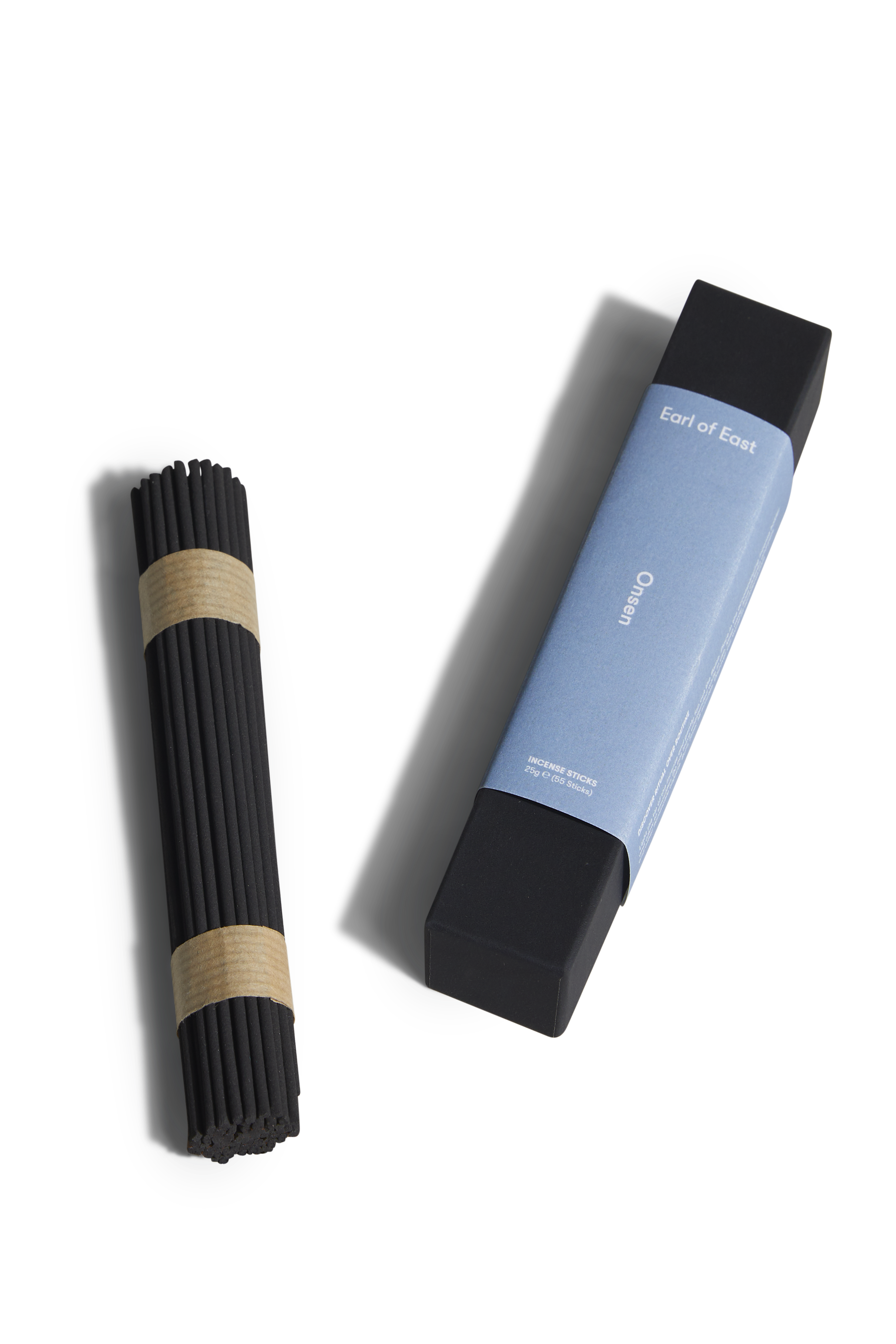Two incense sticks with packaging on a white background