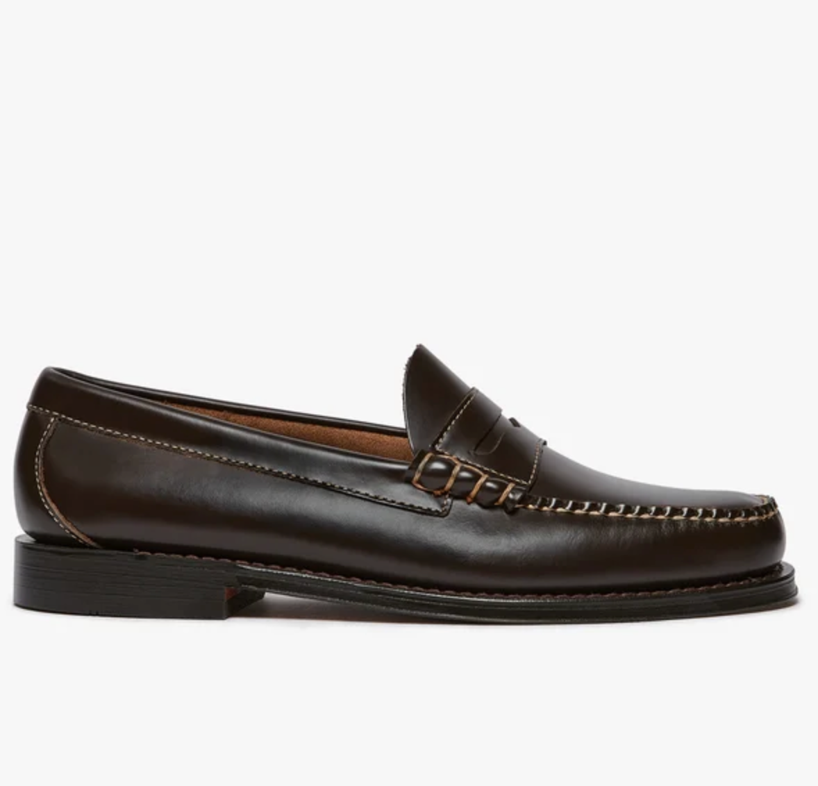 A dark brown leather penny loafer shown in a side profile view against a clean white background.